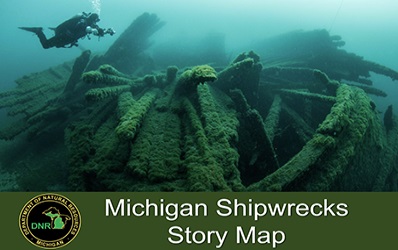 A diver hovers above a shipwreck